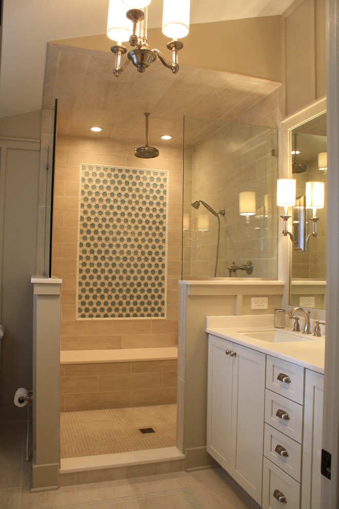 Example of a mid-sized transitional master white tile and glass tile porcelain tile doorless shower design in Philadelphia with an undermount sink, shaker cabinets, white cabinets, quartz countertops, a two-piece toilet and gray walls