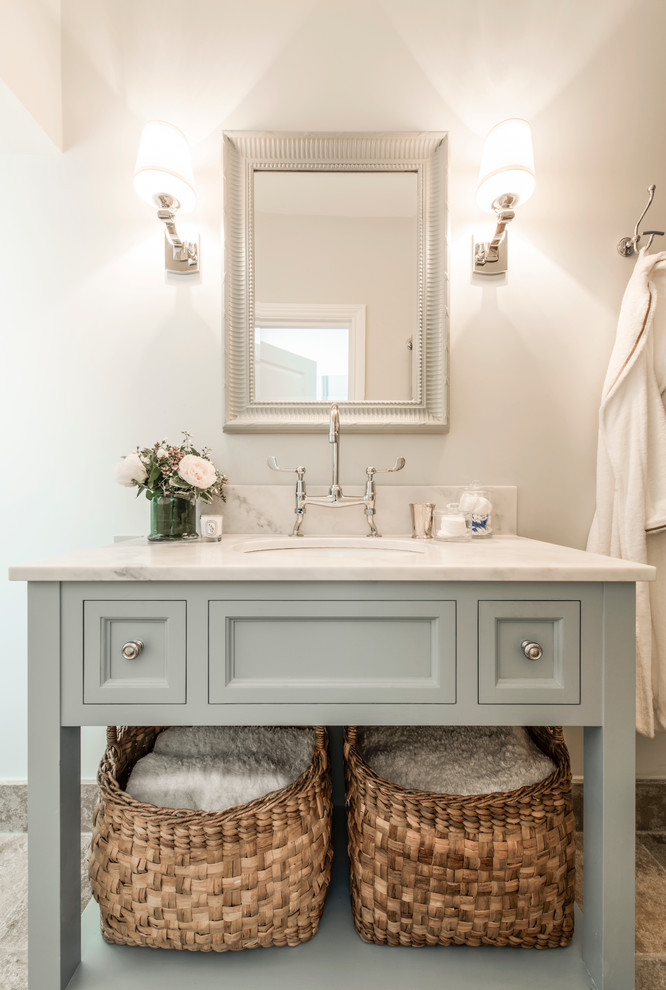 Inspiration for a small timeless master bathroom remodel in London with open cabinets, blue cabinets, marble countertops, gray walls and an undermount sink