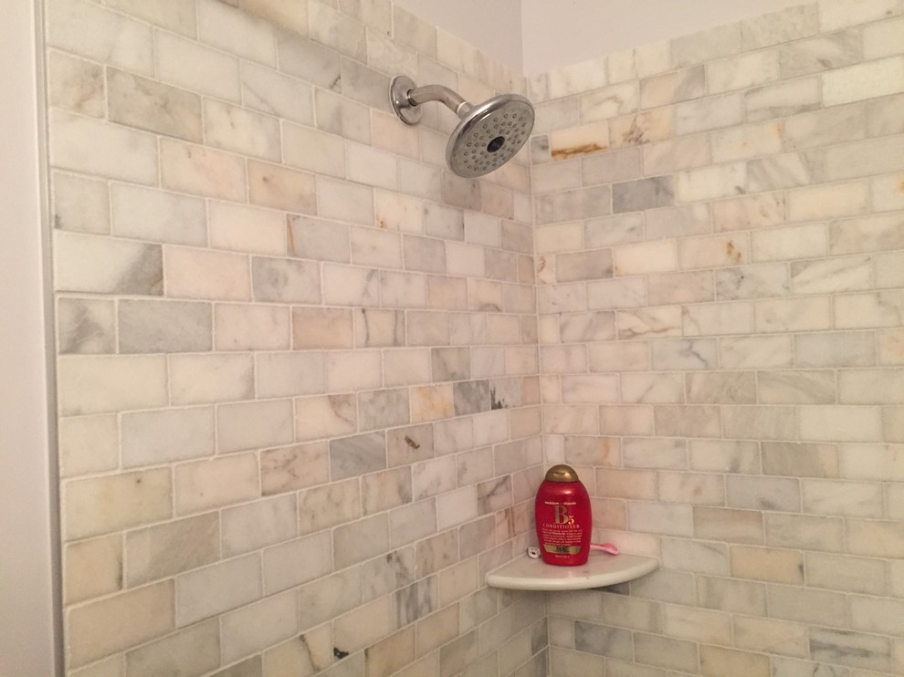 Small traditional shower room bathroom in Orlando with raised-panel cabinets, white cabinets, an alcove bath, an alcove shower, a two-piece toilet, grey tiles, marble tiles, white walls, marble flooring, a submerged sink, engineered stone worktops, grey floors and a hinged door.