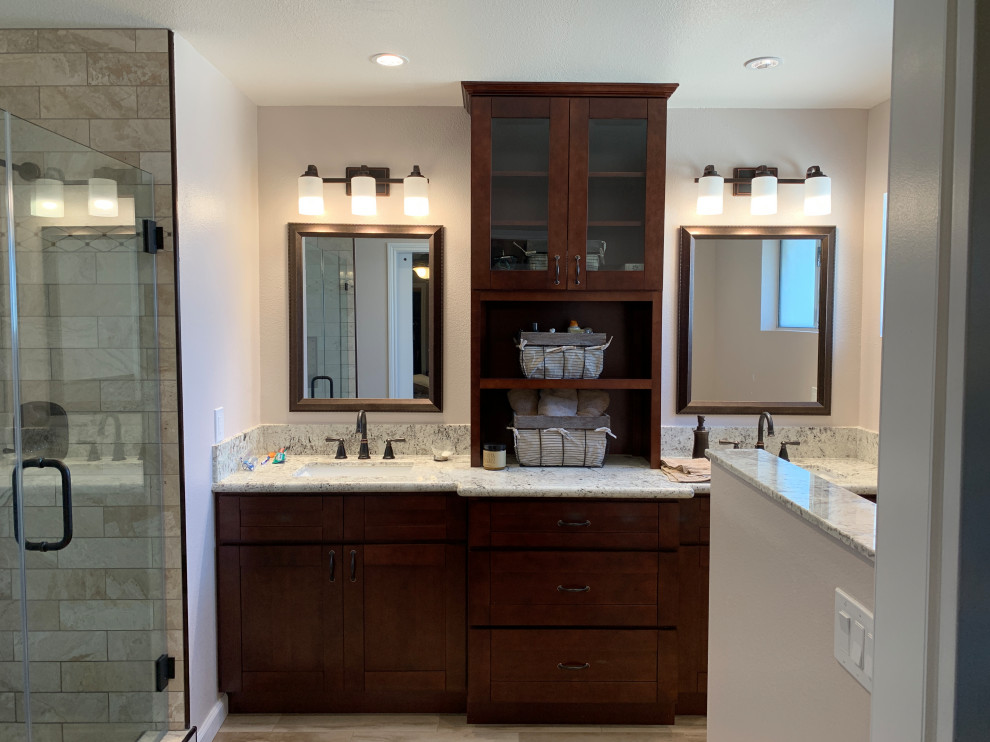 Medium sized modern ensuite bathroom in Orange County with shaker cabinets, brown cabinets, an alcove shower, a two-piece toilet, beige walls, a submerged sink, quartz worktops, brown floors, a hinged door and beige worktops.