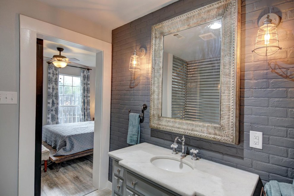 Small farmhouse shower room bathroom in Austin with raised-panel cabinets, grey cabinets, an alcove shower, grey walls, a submerged sink, engineered stone worktops, beige floors, an open shower and white worktops.