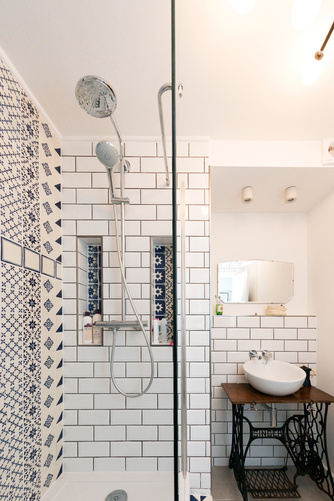 Design ideas for a medium sized mediterranean bathroom in London with freestanding cabinets, black cabinets, a walk-in shower, white tiles, porcelain tiles, white walls, porcelain flooring, a pedestal sink and wooden worktops.