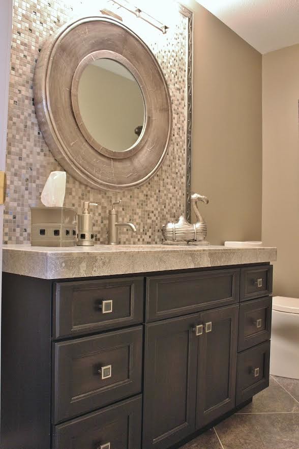 Medium sized traditional shower room bathroom in Boise with raised-panel cabinets, black cabinets, a corner bath, a walk-in shower, a one-piece toilet, grey tiles, white tiles, stone tiles, beige walls, ceramic flooring, a built-in sink and granite worktops.