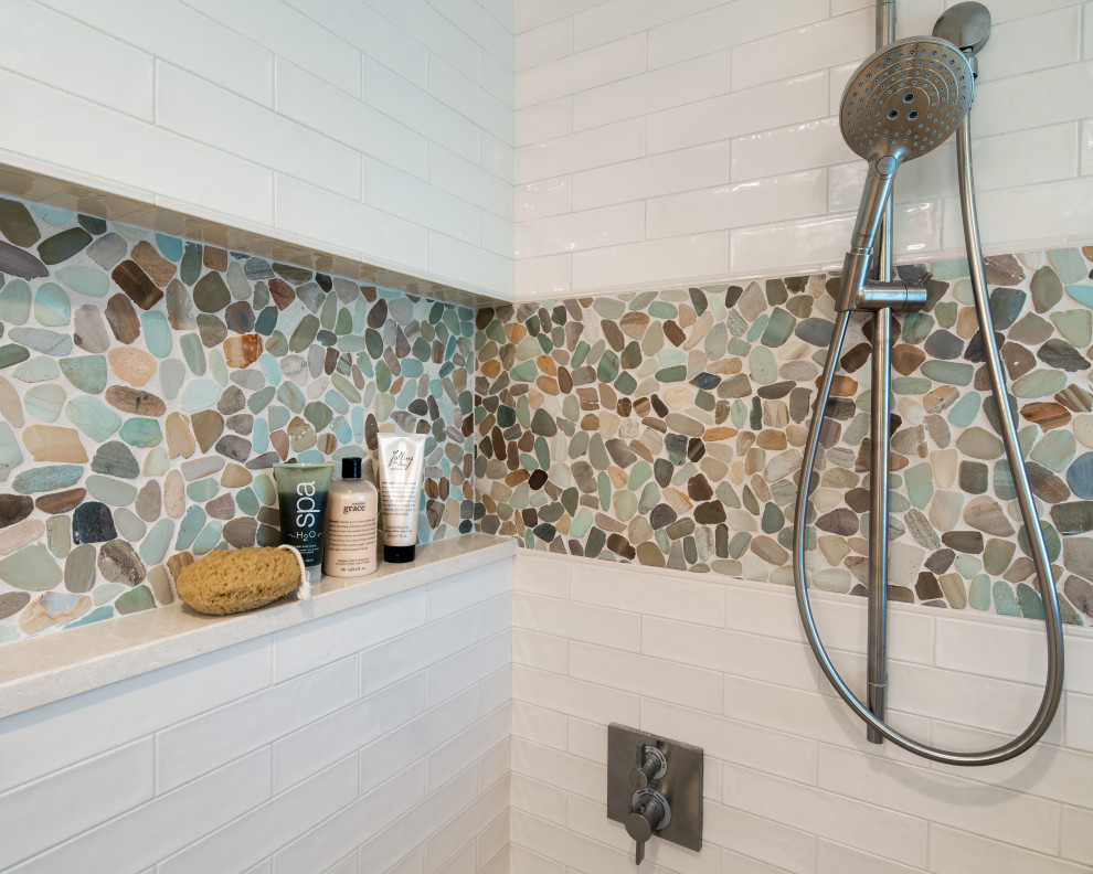Alcove shower - large contemporary master white tile and pebble tile ceramic tile and beige floor alcove shower idea in DC Metro with flat-panel cabinets, light wood cabinets, a one-piece toilet, white walls, an undermount sink, quartz countertops, a hinged shower door and beige countertops