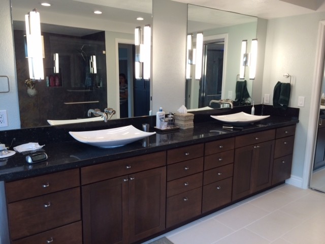 Medium sized contemporary ensuite bathroom in San Francisco with shaker cabinets, brown cabinets, a freestanding bath, a walk-in shower, a bidet, green tiles, glass sheet walls, green walls, laminate floors, a trough sink, engineered stone worktops, beige floors and an open shower.