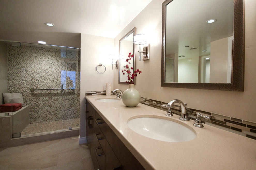 Bathroom - mid-sized contemporary master multicolored tile and matchstick tile porcelain tile and beige floor bathroom idea in San Diego with flat-panel cabinets, dark wood cabinets, beige walls, an undermount sink, a hinged shower door and beige countertops