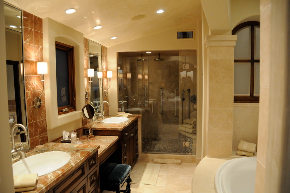 Exemple d'une grande douche en alcôve principale chic en bois foncé avec un placard avec porte à panneau encastré, une baignoire posée, WC à poser, un carrelage beige, des carreaux de céramique, un mur beige, un sol en carrelage de céramique, un lavabo posé et un plan de toilette en onyx.