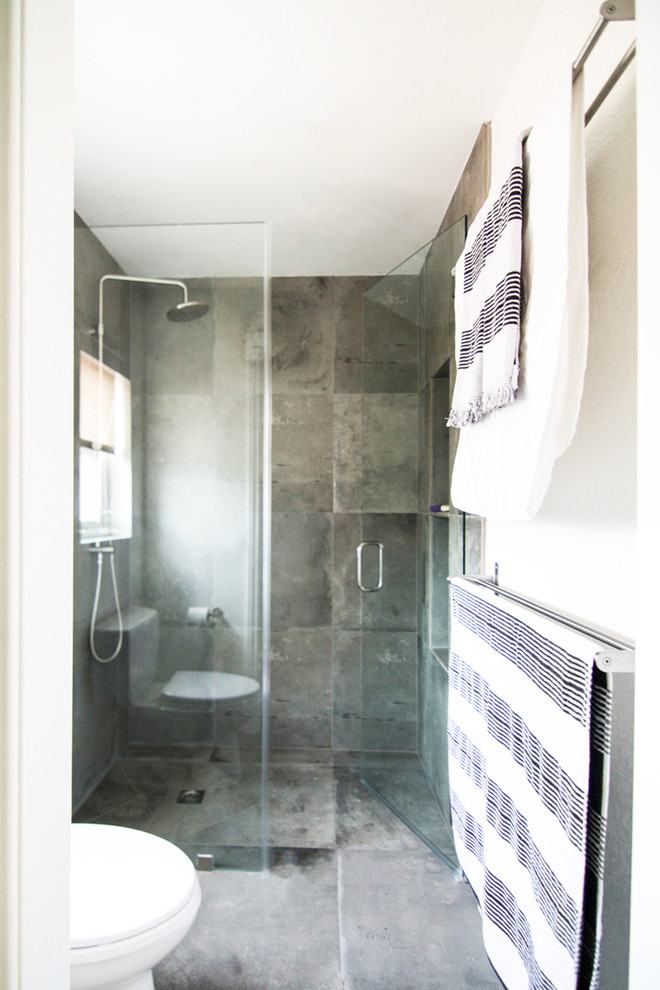 Small traditional ensuite bathroom in Los Angeles with shaker cabinets, grey cabinets, a built-in shower, a two-piece toilet, grey tiles, cement tiles, white walls, concrete flooring, a submerged sink and engineered stone worktops.