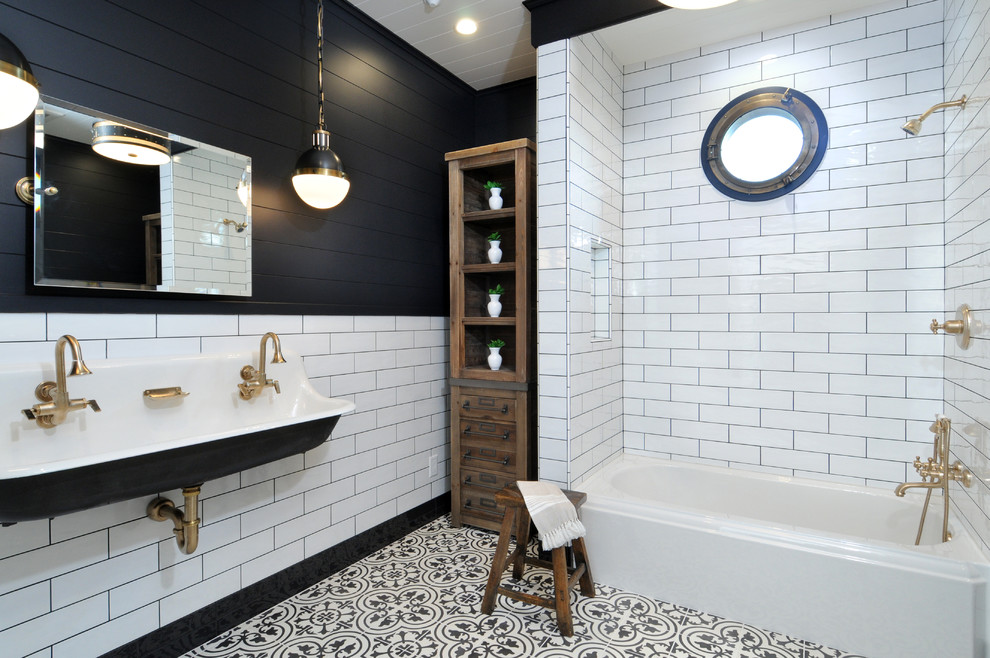 Inspiration for a classic bathroom in Los Angeles with a shower/bath combination, black and white tiles, metro tiles, black walls, a trough sink and a built-in bath.