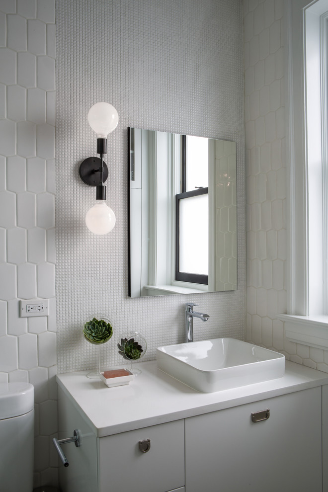 Inspiration for a mid-century modern bathroom remodel in Chicago with flat-panel cabinets, white cabinets, white walls and a vessel sink