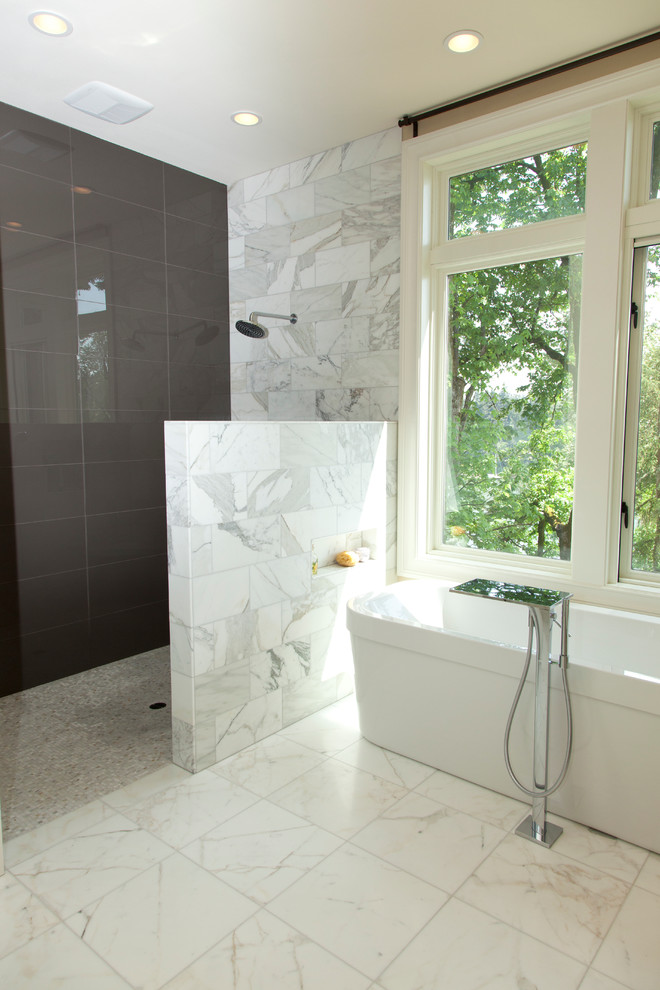 This is an example of a large contemporary ensuite half tiled bathroom in Portland with a freestanding bath, a walk-in shower, grey tiles, marble tiles, beige walls, marble flooring, white floors and an open shower.