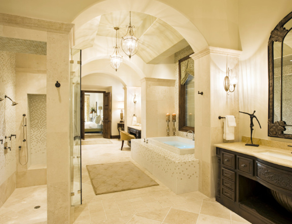 Inspiration for a huge master beige tile and porcelain tile porcelain tile double shower remodel in Chicago with recessed-panel cabinets, dark wood cabinets, limestone countertops, a hot tub, a one-piece toilet and white walls