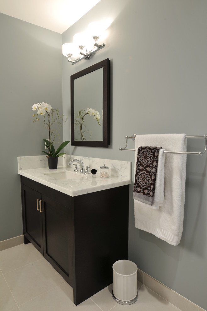 Example of a mid-sized transitional ceramic tile bathroom design in Vancouver with an undermount sink, shaker cabinets, dark wood cabinets, marble countertops and gray walls