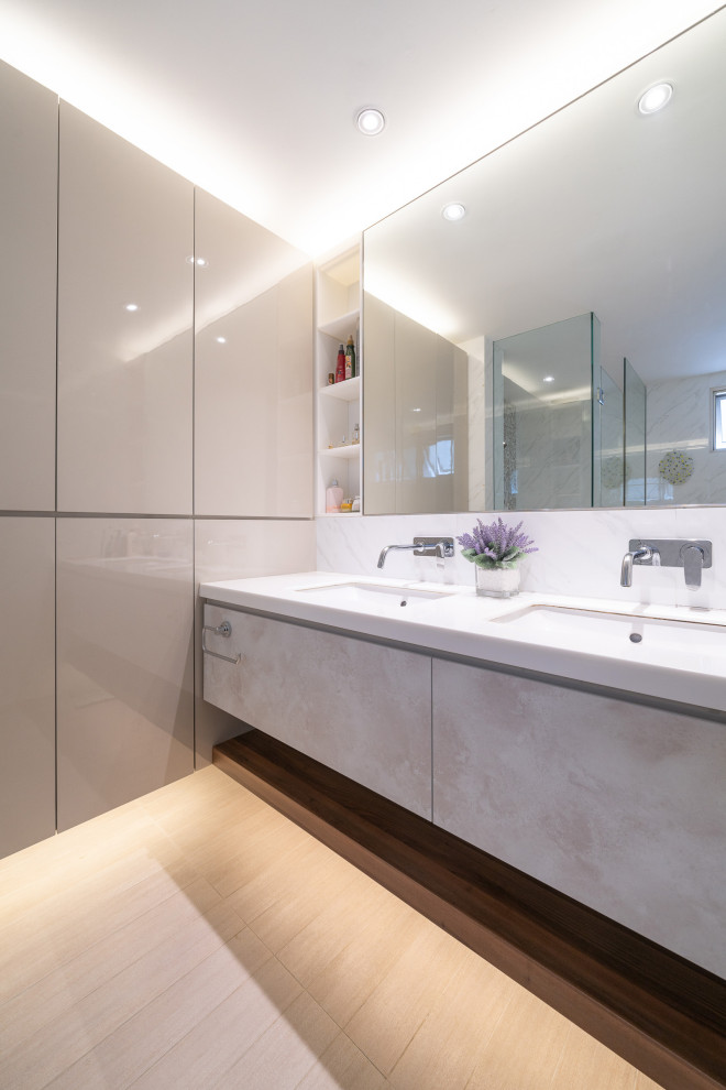 Example of a large trendy master white tile and porcelain tile beige floor and double-sink alcove shower design in Singapore with flat-panel cabinets, gray cabinets, an undermount sink, white countertops, a niche and a floating vanity