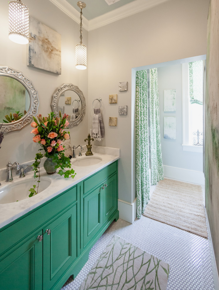 Medium sized traditional bathroom in Charleston with beaded cabinets, green cabinets, an alcove bath, a shower/bath combination, a two-piece toilet, white tiles, grey walls, porcelain flooring, a submerged sink, marble worktops and metro tiles.