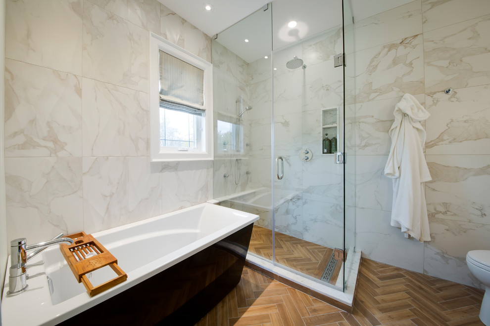 Example of a mid-sized minimalist master beige tile, white tile and marble tile porcelain tile and brown floor bathroom design with shaker cabinets, black cabinets, a one-piece toilet, an undermount sink, granite countertops and a hinged shower door