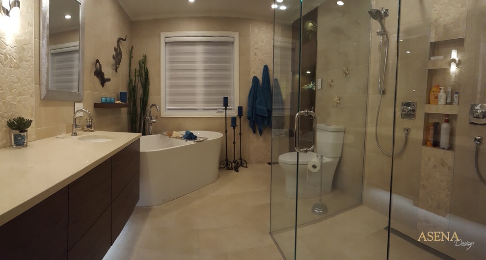 Large traditional shower room bathroom in Montreal with flat-panel cabinets, dark wood cabinets, a freestanding bath, a double shower, a two-piece toilet, beige tiles, pebble tiles, beige walls, porcelain flooring, a submerged sink and engineered stone worktops.