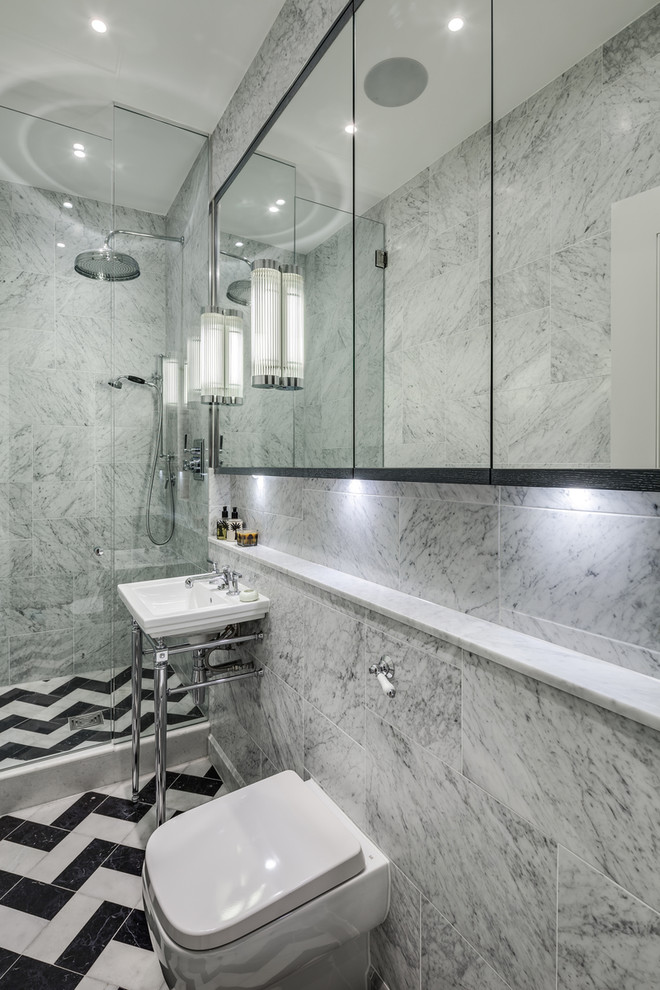 Photo of a small classic ensuite bathroom in London with a console sink, a walk-in shower, a wall mounted toilet, grey tiles, stone tiles, grey walls and marble flooring.