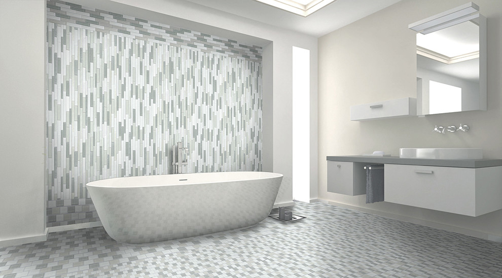 Modern inredning av ett stort en-suite badrum, med ett fristående handfat, släta luckor, grå skåp, laminatbänkskiva, ett fristående badkar, flerfärgad kakel, keramikplattor, vita väggar och klinkergolv i keramik