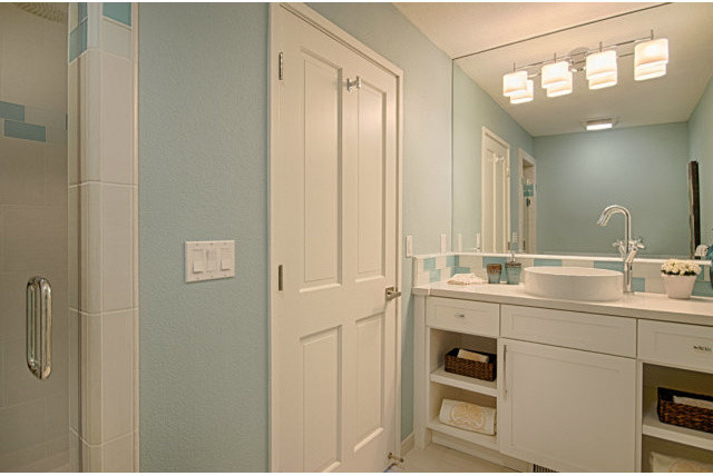 Medium sized modern shower room bathroom in San Francisco with a built-in sink, shaker cabinets, white cabinets, marble worktops, a freestanding bath, a corner shower, a one-piece toilet, blue tiles, glass tiles, blue walls and porcelain flooring.