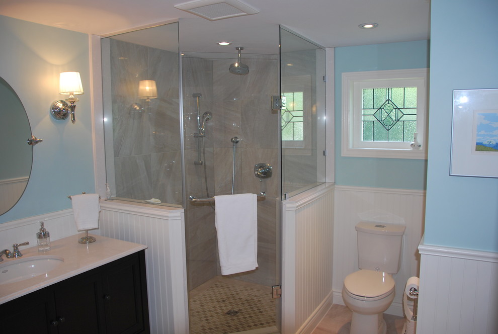Photo of a medium sized classic shower room bathroom in Toronto with a submerged sink, engineered stone worktops, a corner shower, a two-piece toilet, beige tiles, ceramic tiles, blue walls, ceramic flooring, shaker cabinets and black cabinets.