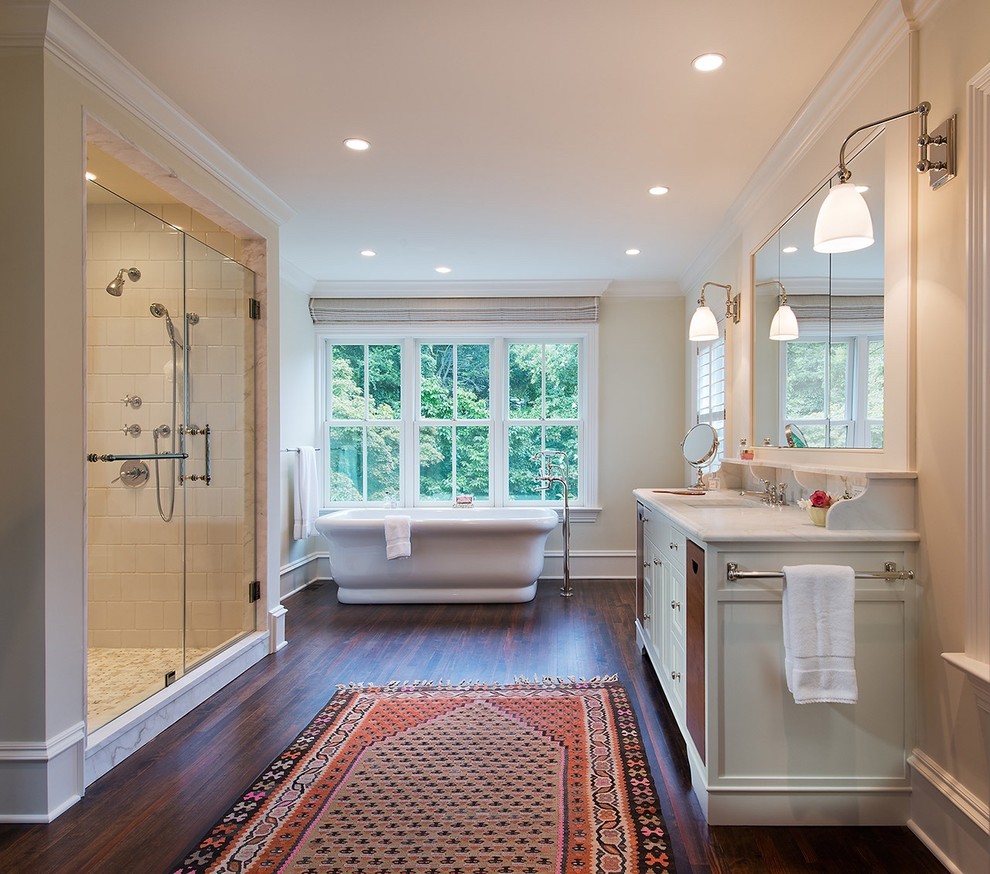 Inspiration for a huge transitional master beige tile and stone tile dark wood floor bathroom remodel in DC Metro with furniture-like cabinets, white cabinets, a two-piece toilet, beige walls, an undermount sink and marble countertops