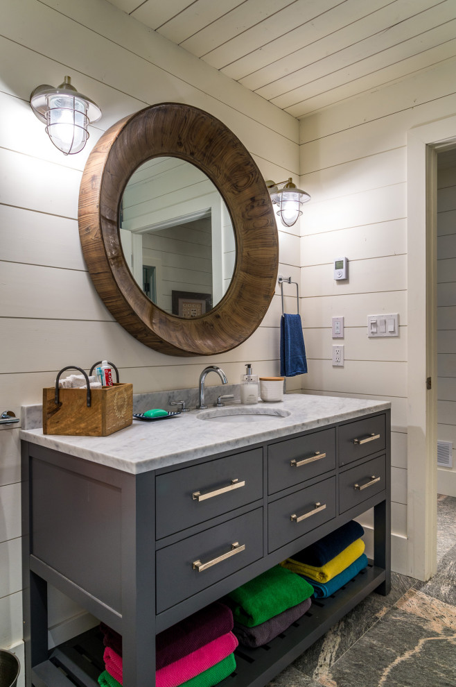 Inspiration for a medium sized farmhouse shower room bathroom in Toronto with grey cabinets, white walls, a submerged sink, grey floors, grey worktops, a single sink, a built in vanity unit, tongue and groove walls and flat-panel cabinets.