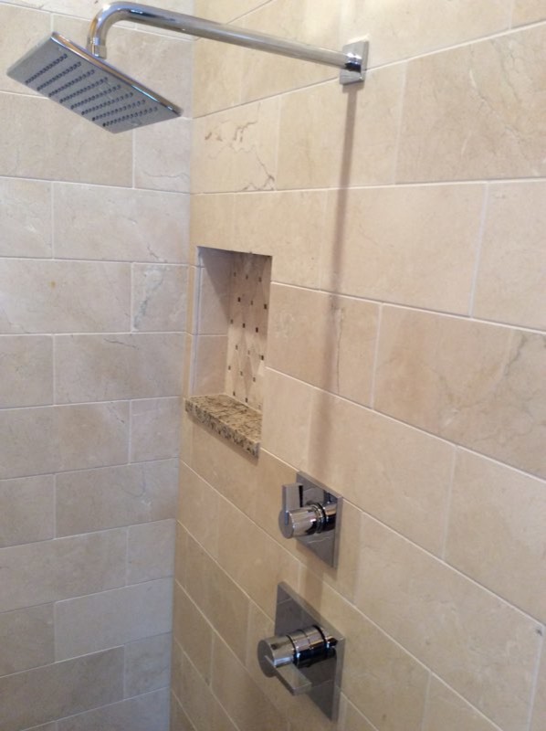 Photo of a medium sized mediterranean ensuite bathroom in Orlando with shaker cabinets, dark wood cabinets, a built-in bath, an alcove shower, a one-piece toilet, beige tiles, travertine tiles, yellow walls, marble flooring, a submerged sink, granite worktops, beige floors and a hinged door.