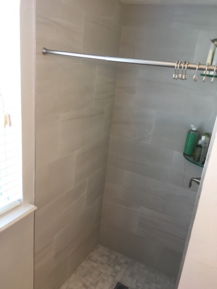 Bathroom - mid-sized modern master beige tile and porcelain tile porcelain tile and gray floor bathroom idea in Jacksonville with shaker cabinets, beige cabinets, white walls, an undermount sink, quartzite countertops and gray countertops