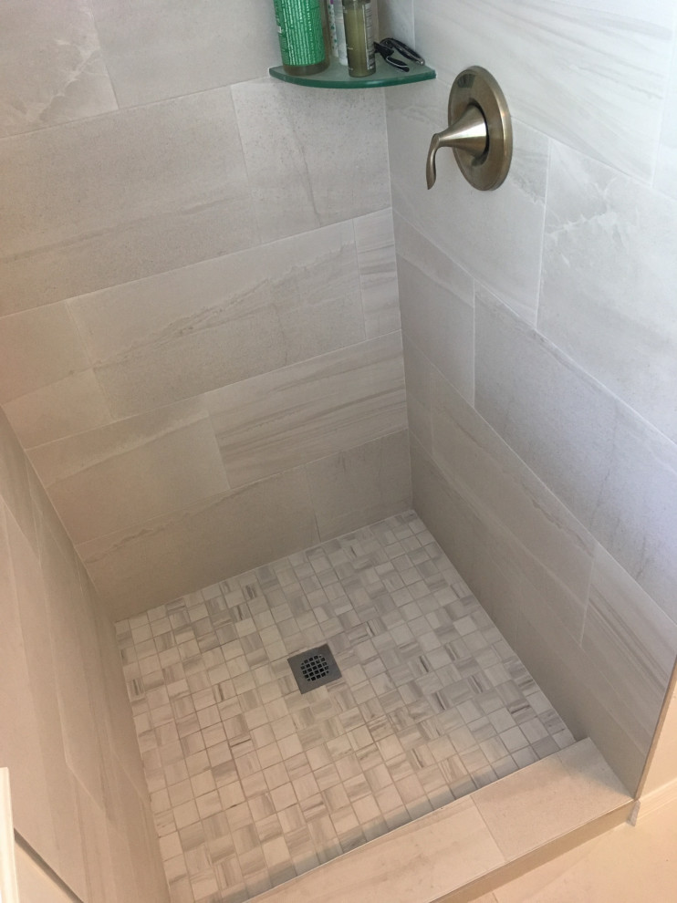 Inspiration for a mid-sized modern master beige tile and porcelain tile porcelain tile and gray floor bathroom remodel in Jacksonville with shaker cabinets, beige cabinets, white walls, an undermount sink, quartzite countertops and gray countertops