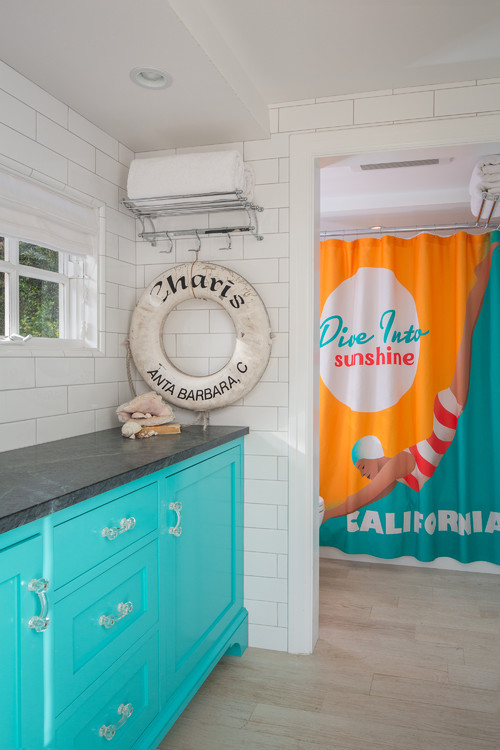 Coastal Harmony: Boys Bathroom Ideas with Turquoise Vanity and Graphic Shower Curtain