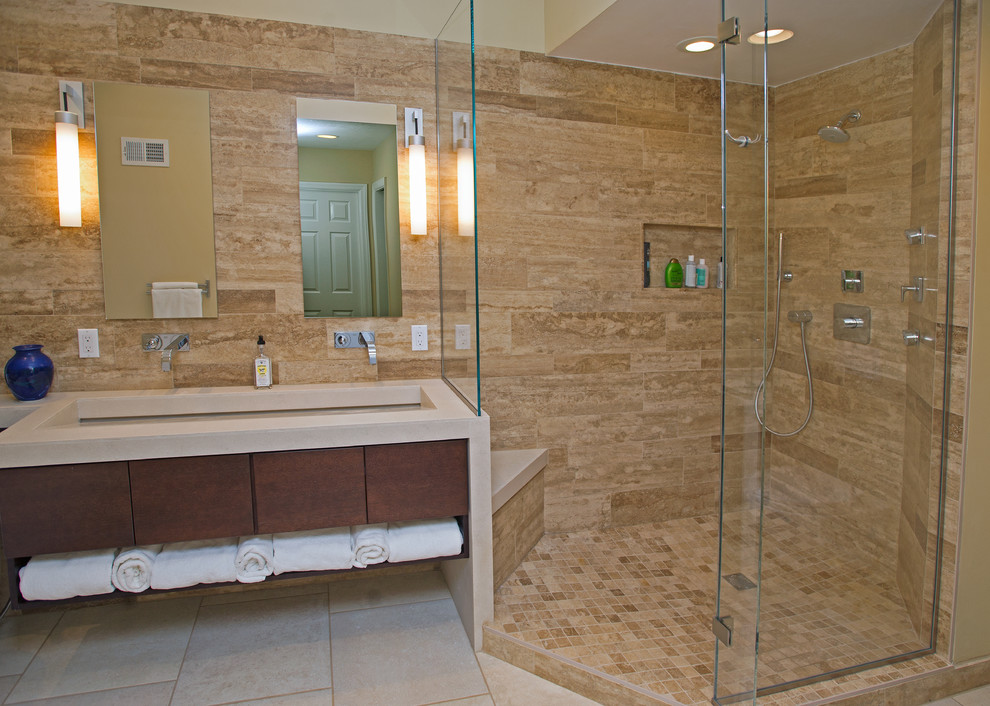 Example of a large minimalist master beige tile and ceramic tile ceramic tile bathroom design in Other with flat-panel cabinets, dark wood cabinets, a wall-mount toilet, yellow walls, a trough sink and quartz countertops