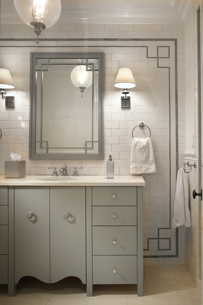Bathroom - mid-sized traditional kids' white tile and ceramic tile marble floor bathroom idea in New York with flat-panel cabinets, gray cabinets, white walls, an undermount sink and marble countertops