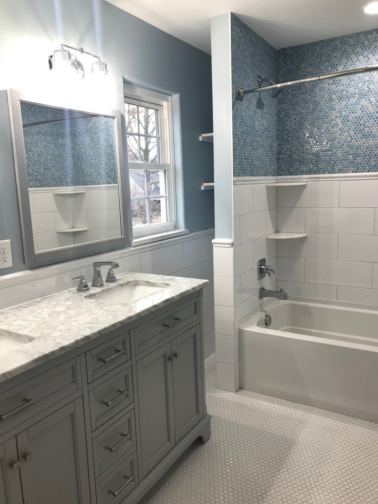 Small elegant kids' white tile and ceramic tile porcelain tile and white floor bathroom photo in Indianapolis with recessed-panel cabinets, gray cabinets, blue walls, an undermount sink, marble countertops and gray countertops