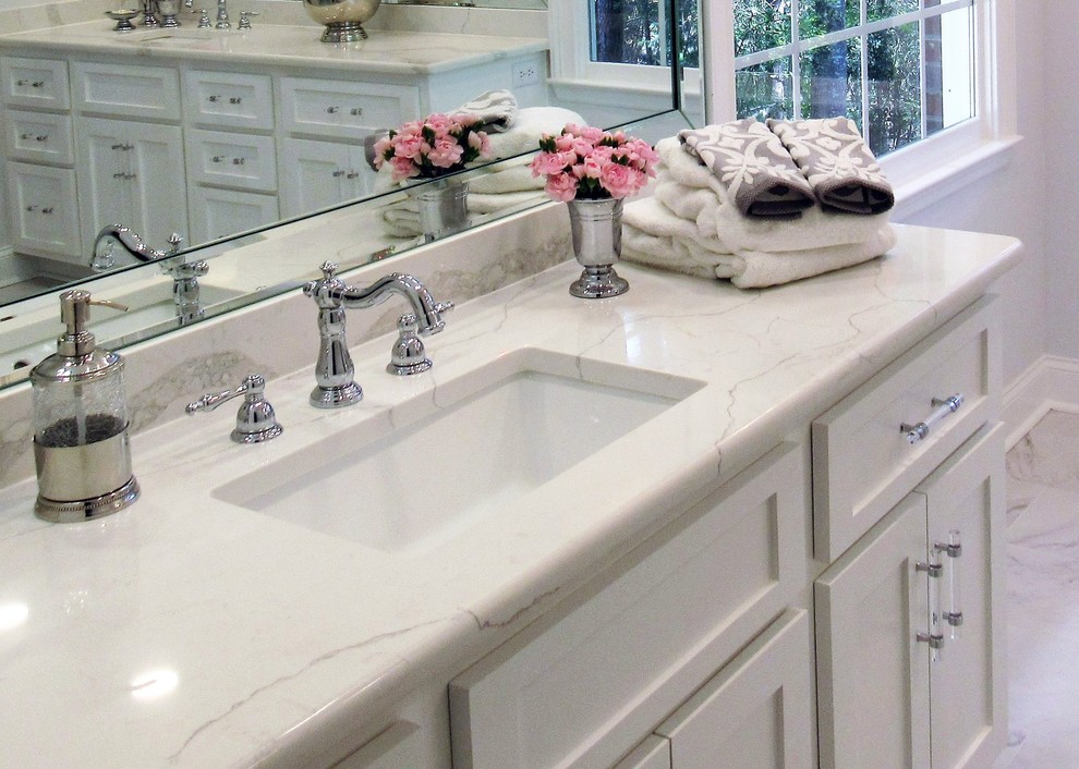Example of a mid-sized trendy master porcelain tile and white floor bathroom design in Columbus with shaker cabinets, white cabinets, an undermount sink, quartz countertops and white countertops