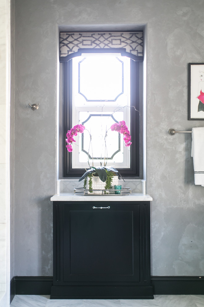 Example of a mid-sized transitional master white tile and marble tile marble floor bathroom design in Orange County with furniture-like cabinets, black cabinets, a two-piece toilet, gray walls, an undermount sink and marble countertops