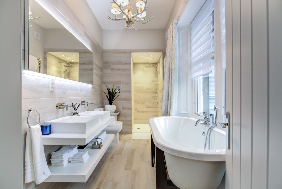 Inspiration for a large contemporary ensuite bathroom in Glasgow with open cabinets, white cabinets, a freestanding bath, a one-piece toilet, white tiles, white walls, solid surface worktops, white worktops, an alcove shower, a vessel sink, beige floors and an open shower.
