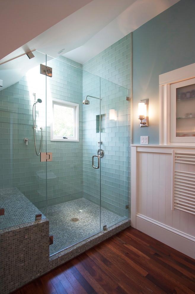 Corner shower - mid-sized contemporary master subway tile dark wood floor corner shower idea in San Francisco with white cabinets and blue walls