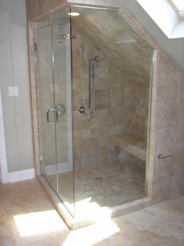 This is an example of a medium sized contemporary ensuite bathroom in Raleigh with a corner shower, beige tiles, stone tiles, grey walls and ceramic flooring.