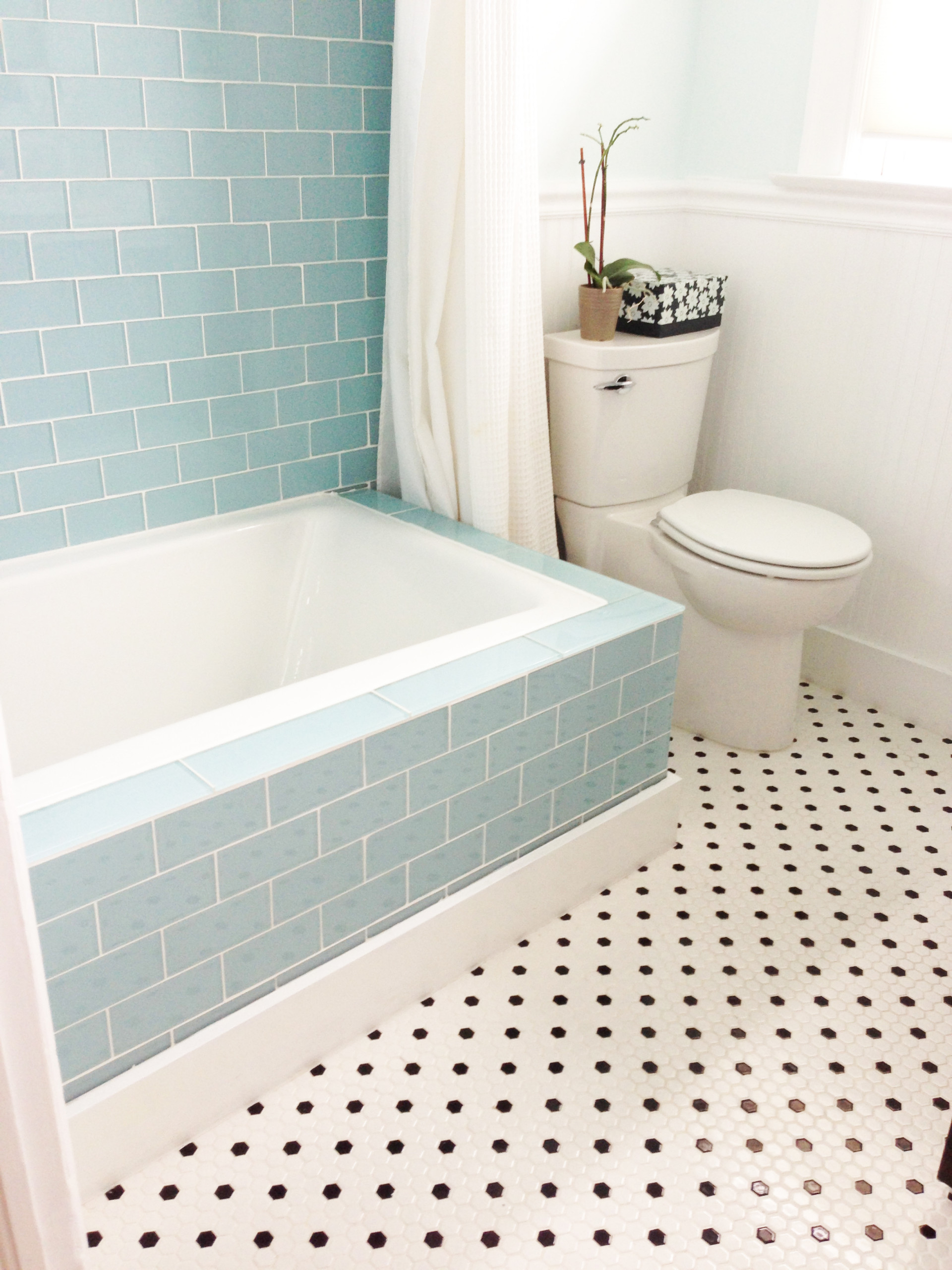 white glass subway tile bathroom