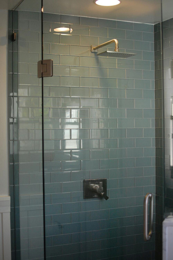 This is an example of a contemporary bathroom in Other with blue tiles and glass tiles.