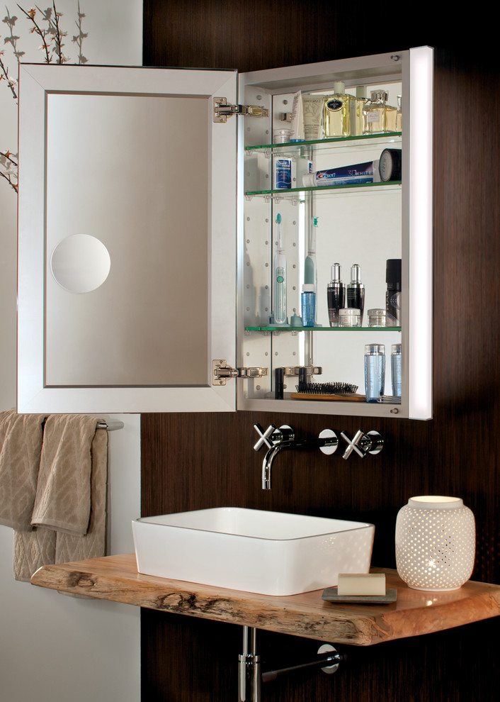 Expansive contemporary ensuite bathroom in New York with a vessel sink, glass-front cabinets, wooden worktops, beige walls and ceramic flooring.