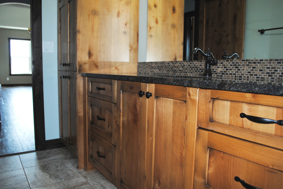 Example of a mountain style bathroom design in Other with shaker cabinets