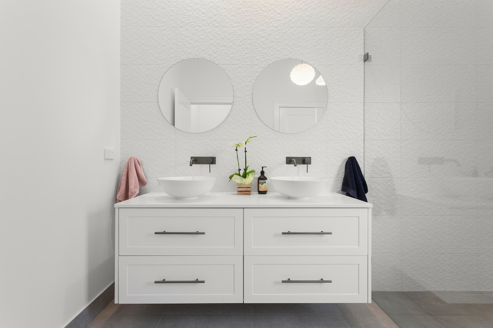 Design ideas for a medium sized contemporary family bathroom in Melbourne with shaker cabinets, white cabinets, a walk-in shower, white tiles, ceramic tiles, white walls, ceramic flooring, engineered stone worktops, grey floors, an open shower, white worktops, a wall niche, double sinks and a floating vanity unit.