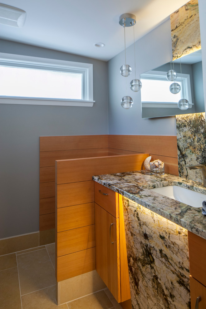 Example of a mid-sized mid-century modern 3/4 beige tile and porcelain tile porcelain tile bathroom design in Other with flat-panel cabinets, light wood cabinets, blue walls, an undermount sink and granite countertops