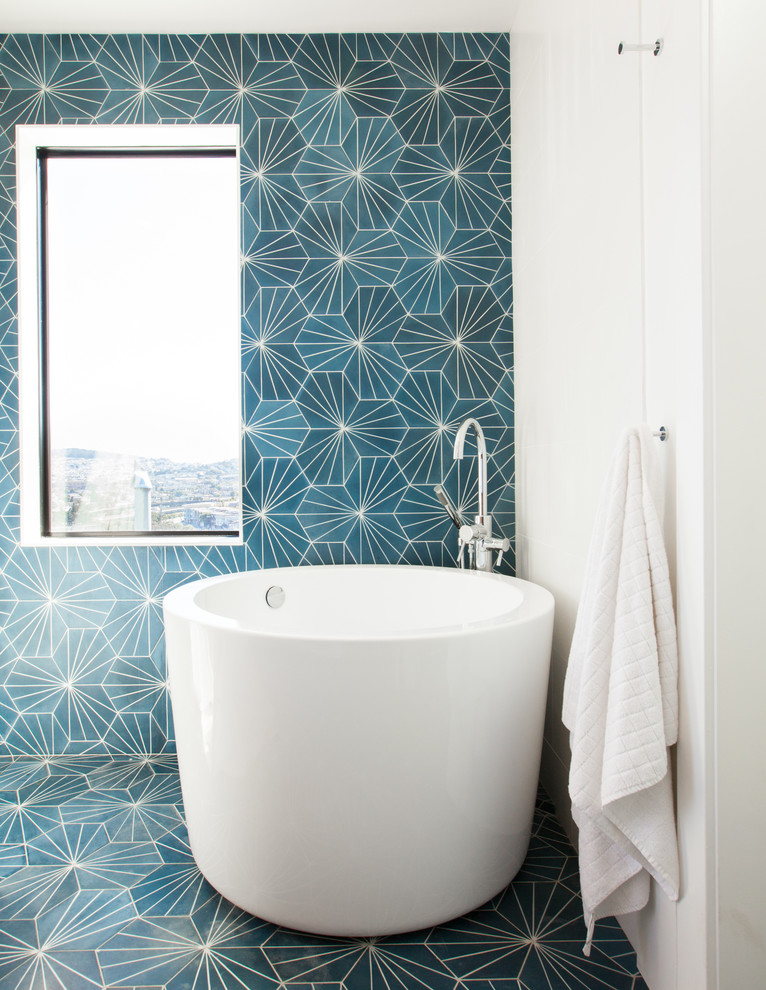 Example of a mid-sized minimalist master blue tile and cement tile cement tile floor bathroom design in San Francisco with flat-panel cabinets, medium tone wood cabinets, a wall-mount toilet, white walls, an undermount sink and quartz countertops