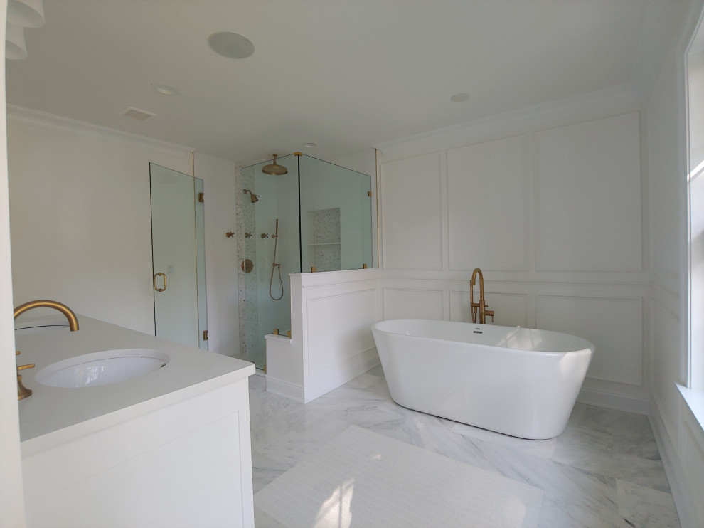 This is an example of a small classic ensuite bathroom in Other with shaker cabinets, white cabinets, a submerged bath, a walk-in shower, a two-piece toilet, black and white tiles, porcelain tiles, white walls, mosaic tile flooring, marble worktops, grey floors, a hinged door and white worktops.