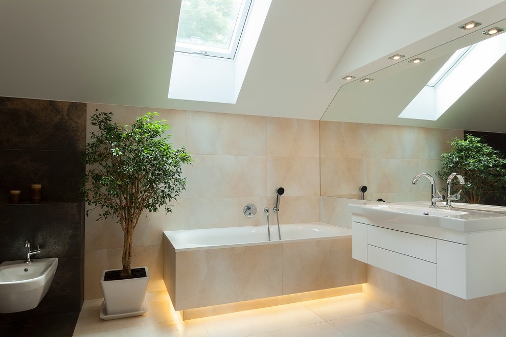 This is an example of an expansive ensuite bathroom in Los Angeles with a built-in sink, flat-panel cabinets, white cabinets, granite worktops, a built-in bath, a shower/bath combination, a one-piece toilet, multi-coloured tiles, porcelain tiles, multi-coloured walls and porcelain flooring.