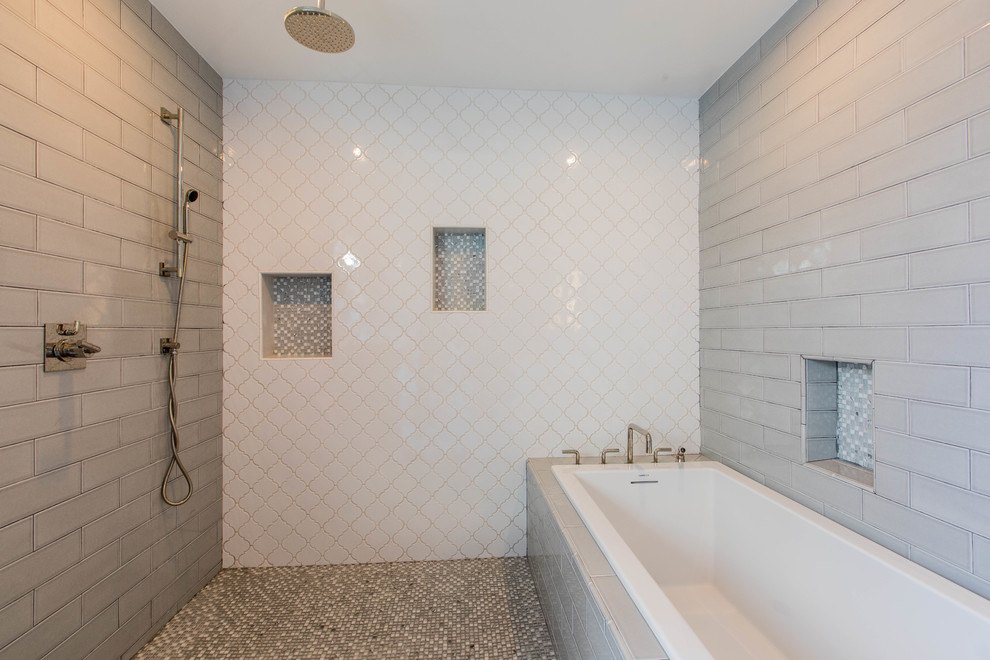 Large classic ensuite wet room bathroom in Los Angeles with freestanding cabinets, white cabinets, a built-in bath, a one-piece toilet, grey tiles, white tiles, metro tiles, grey walls, porcelain flooring, a submerged sink, quartz worktops, grey floors, an open shower and white worktops.