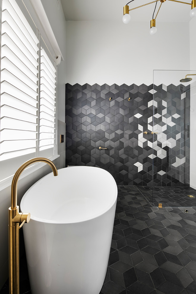 Design ideas for a contemporary ensuite bathroom in Adelaide with freestanding cabinets, dark wood cabinets, a freestanding bath, a walk-in shower, multi-coloured tiles, cement tiles and grey walls.
